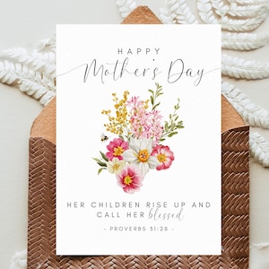 May include: Mother's Day greeting card with a watercolor floral arrangement of pink, yellow, and white flowers. The card reads "Happy Mother's Day" and a Bible verse. The card is inside a brown envelope.