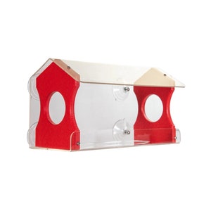 May include: A red and clear acrylic bird feeder with two feeding stations and a clear roof. The feeder is designed to be attached to a window with suction cups.