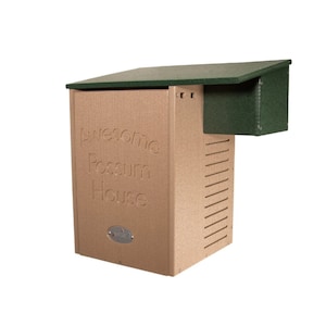 May include: A tan-colored possum house with a green roof and a small, attached green box. The words "Awesome Possum House" are embossed on the front. The house has ventilation slits and a small, silver-colored emblem.