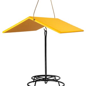 May include: Yellow bird feeder with a black metal base and a yellow roof. The feeder hangs from a wire loop.