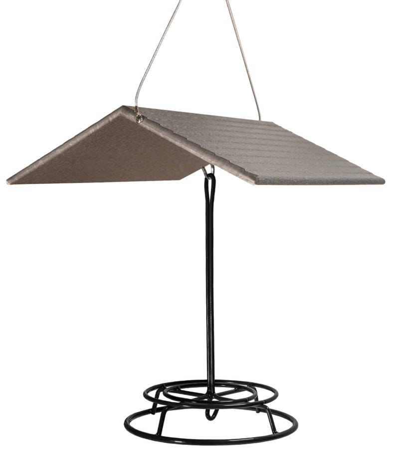 May include: A black metal bird feeder with a gray, angled roof. The feeder has a circular base and a hanging hook.