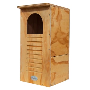 May include: A wooden birdhouse with a rectangular shape and a small roof. The front features an arched opening and a series of horizontal slats. The birdhouse is made of light-colored wood with visible grain.