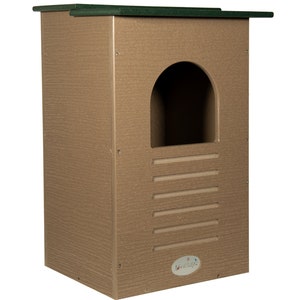 May include: A rectangular birdhouse with a textured, light brown finish and a dark green roof. It features a rounded entrance and horizontal ventilation slots. The birdhouse has the "Jo-Wild" logo on the lower right.