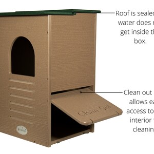 May include: A tan-colored outdoor cat house with a green roof. Features include an arched entry, a clean-out door, and text that reads "Clean Out". The roof is sealed to prevent water from entering. The design allows easy access for cleaning.