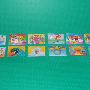 Sellos antiguos de las Naciones Unidas de Peter Max, 2002: 12 sellos de la Cumbre de la Tierra + 10 - Para manualidades, exposiciones, proyectos, álbumes de recortes e historia del arte