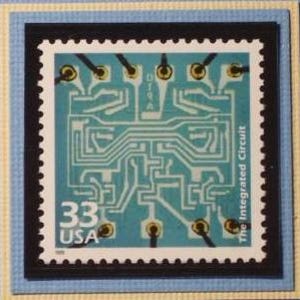 May include: A blue and white postage stamp with a circuit board design and the text "The Integrated Circuit" and "33 USA".