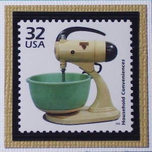 May include: A vintage 32 cent USA postage stamp featuring a white and green stand mixer with a black handle. The stamp reads "Household Conveniences".