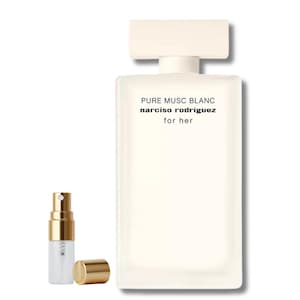 May include: A white rectangular perfume bottle with a matching cap and the text "PURE MUSC BLANC narciso rodriguez for her." A small, clear spray bottle with a gold-colored top and a separate gold cap is next to the perfume bottle.