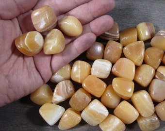 Orange Calcite Tumbled Stone 1 inch + Crystal