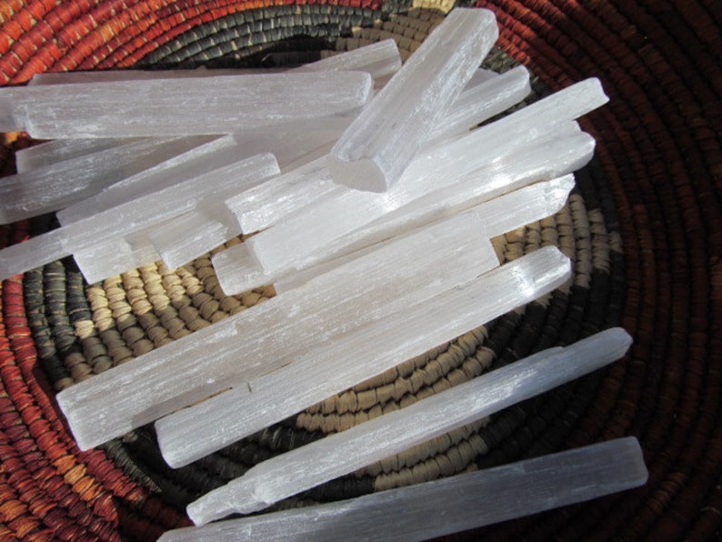 Selenite raw medium length wands on weaved basket