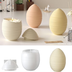 May include: A set of three ceramic mugs with a speckled, matte finish. The mugs are in cream, light grey, and dark grey. Each mug has a simple, minimalist design, ideal for coffee or tea.