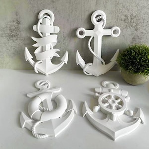 May include: Four white decorative anchors with different nautical details. The anchors are made of a smooth, white material and have a 3D design. The anchors are perfect for adding a nautical touch to any home decor.