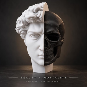 May include: A split-face sculpture featuring a white classical male bust on the left and a black human skull on the right. The base includes the text BEAUTY X MORTALITY and TWO SIDES. ONE STATEMENT. The object is presented as a single head.