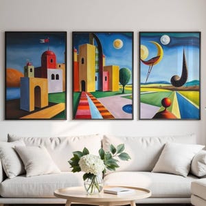 May include: A set of three framed wall art prints featuring surreal architectural landscapes with vibrant yellow, red, and blue buildings, geometric pathways, floating celestial bodies, and abstract organic shapes under a deep blue night sky.