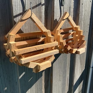 May include: A set of three ceramic mugs with a speckled, matte finish. The mugs are in shades of cream, light gray, and dark gray. Each mug has a simple, minimalist design, perfect for coffee or tea.