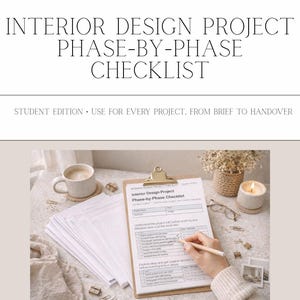 May include: An "Interior Design Project Phase-by-Phase Checklist" is displayed, labelled "Student Edition". A hand is using a pencil to mark the checklist. A coffee cup, candle, and other items are on the table. The text "DE'VALENCE DESIGNS" is at the top.