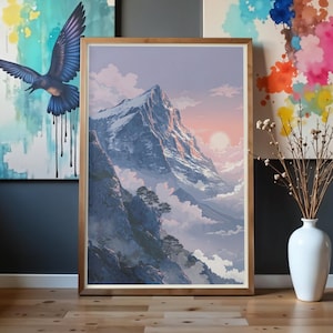 Puede incluir: Una impresión artística enmarcada que representa un paisaje de montaña al atardecer. La obra de arte presenta un pico nevado, nubes y una paleta de colores pastel. La impresión está en un marco de madera.