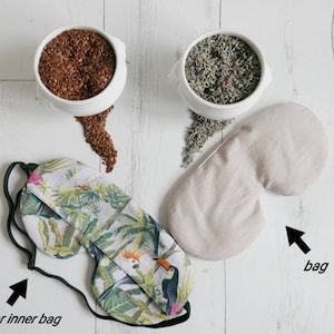 May include: A beige eye mask with a tropical print cover. The eye mask is filled with flax seeds and lavender. The eye mask is a great way to relax and unwind.