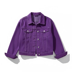 May include: A purple denim jacket with a classic design. The jacket features a collared neckline, button-down front, two chest pockets, and buttoned cuffs. The sleeves are cuffed, and the jacket is made of a solid purple fabric.