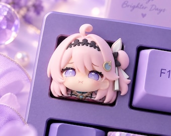 May include: A custom mechanical keyboard keycap featuring a sculpted, chibi-style anime character with light pink hair, a black headband, and purple eyes. The keycap is set into a purple keyboard frame with the text Good Keys Brighter Days visible.