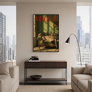 May include: A framed wall art print featuring a cheetah resting on a green tufted sofa in a sunlit room, with the word VOGUE printed in bold red letters at the top. The artwork displays a warm, golden light casting long shadows across the scene.