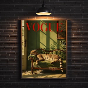 May include: A rectangular wall art print featuring a cheetah resting on a green velvet sofa. The word VOGUE is printed in large red capital letters at the top. The scene includes a doorway, a framed picture, and shadows cast by sunlight.
