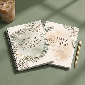 May include: Two spiral-bound journals with cream covers featuring watercolor botanical illustrations. One cover reads "BONUS WELLNESS TOOLKIT" and the other "30 DAYS TO CALM Nervous System Reset Journal." A gold pen lies beside the journals.