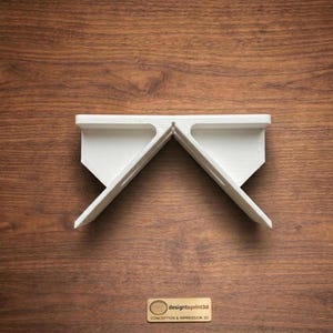 May include: A set of three ceramic mugs with a speckled, matte finish. The mugs are in shades of cream, light gray, and dark gray. Each mug has a simple, minimalist design, perfect for coffee or tea.