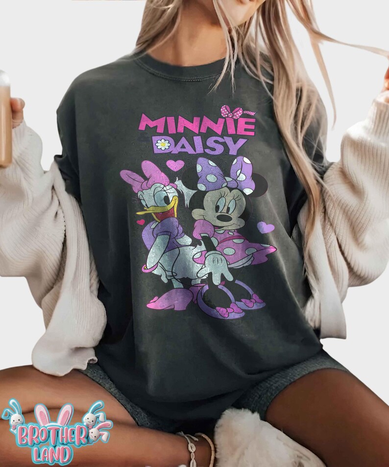 May include: A white ceramic mug with a black handle and the text "But First, Coffee" in a handwritten style. The mug is on a white surface. The mug is likely for hot beverages.