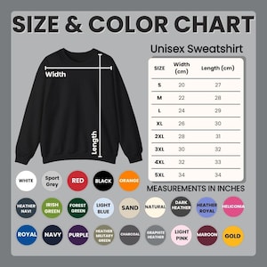 May include: A black unisex sweatshirt with a size and color chart. The chart shows measurements in centimeters and inches. Available colors include white, sport grey, red, black, and orange.
