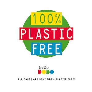 May include: A green circle with the text "100% PLASTIC FREE" in yellow, red, and blue lettering. Below the circle is the text "hello DODO" in yellow, red, and blue lettering. The text "ALL CARDS ARE SENT 100% PLASTIC FREE!" is below the logo.