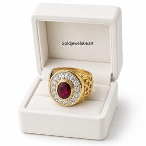 May include: A gold ring featuring a central oval-cut deep red gemstone surrounded by a halo of small clear stones. The band has an intricate openwork pattern on the sides. The ring is presented in a white box with the text Goldjewels06art.