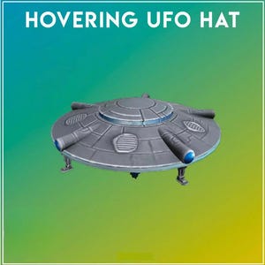 May include: A grey hat shaped like a flying saucer with the text HOVERING UFO HAT printed above it. The hat features a circular dome, radial panels, and several cylindrical protrusions with blue accents, along with small landing gear-like structures.
