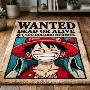 May include: Rectangular rug featuring a smiling cartoon character in a red hat and open shirt. The rug has a vintage poster design with the word "WANTED" at the top, and the text "DEAD OR ALIVE" and "$1,500,000,000 BERRIES" below.