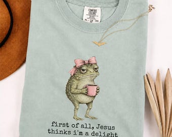 First Of All Jesus Thinks I’m A Delight Shirt, Funny Christian Frog T-Shirt, Frog With Bow Coffee Shirt, Cute Retro Christian Graphic Shirt