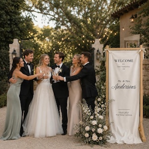 Personalized wedding welcome banner on wooden frame stand, romantic garden wedding entrance decor with custom names and date