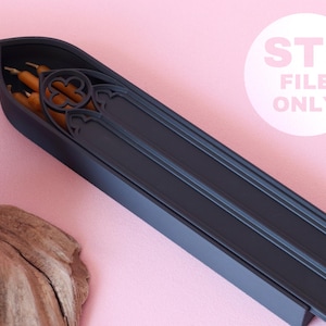 May include: A matte black, elongated, pointed-arch container featuring intricate gothic-style tracery patterns on its lid. Inside, several thin, orange-colored taper candles are visible. The text STL FILE ONLY is printed in white on the right.