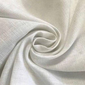 May include: A piece of white fabric with a visible woven texture, arranged in a swirling, gathered pattern that creates soft folds and shadows. The material has a matte finish and a consistent, neutral white color throughout the entire surface.