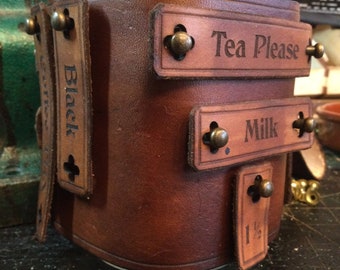 Adaptable Steampunk style mason jar mug cozy made from full grain veg tan leather. Free UK delivery.