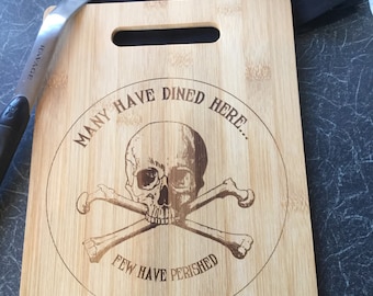 Personalised cutting, chopping board in Bamboo. “Many Have Dined Here. Few Have Perished” Free UK shipping.