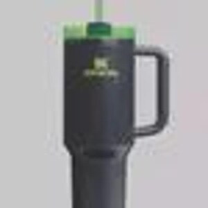 May include: A black insulated travel mug with a green lid and handle. The mug has a straw and a green logo. Designed to keep drinks cold or hot for hours, it's ideal for travel or daily use.