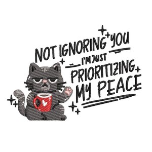 May include: Embroidered design featuring a grumpy gray cat holding a red mug with a heart. Text reads "NOT IGNORING YOU, I'M JUST PRIORITIZING MY PEACE" in a handwritten style. Decorative plus signs are included.