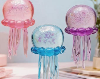 Soft jellyfish squeeze ball with glitter to relieve anxiety. Fun and sensory jellyfish stress ball, cute squeeze toy suitable for all ages.