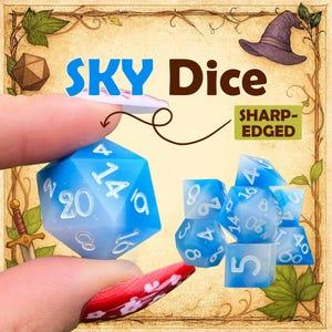 Peut inclure: Un ensemble de dés polyédriques à bords tranchants avec un dégradé de bleu ciel et de blanc, portant des chiffres blancs. Le texte SKY Dice et SHARP-EDGED est visible. Les dés ont une finition translucide avec des paillettes dans la résine.