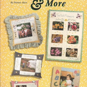 May include: A book cover titled Memory Pillows & More by Dianna Akers featuring a yellow floral background with four fabric pillows. The pillows display printed photographs, embroidered text, and decorative stitching, including themes of flowers, family, and alphabet letters.