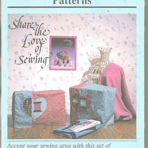 May include: A promotional image for sewing machine and serger cover patterns. The image features two covers with heart-shaped cutouts, a poster with spools of thread, and the text "Share the Love of Sewing".