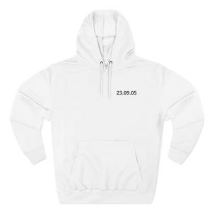 May include: White hooded sweatshirt with a front pocket and drawstring. The date "23.09.05" is printed in black on the upper chest area. The sweatshirt has long sleeves and a hood.