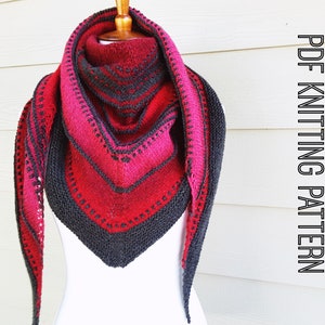 May include: A triangular shawl knitted in black and red yarn with a geometric pattern. The shawl is draped over a white mannequin. The text "PDF KNITTING PATTERN" is visible in the image.