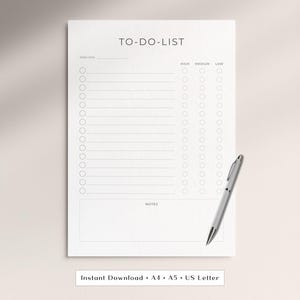 May include: A white to-do list notepad with a silver pen. The notepad has a simple design with the words "TO-DO-LIST" at the top, a section for the week, and checkboxes for high, medium, and low priority tasks. The notepad is A4, A5, and US Letter size.