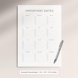 May include: A white paper sheet titled IMPORTANT DATES with twelve monthly sections, each containing a list of lines and circular checkboxes. A silver ballpoint pen rests on the bottom right corner. Text at the bottom reads Instant Download A4 A5 US Letter.